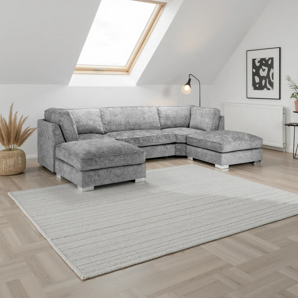 Gray sectional sofa in a living room with a rug and decorative elements, shop now , free uk delivery , ukfurnish , bishop 