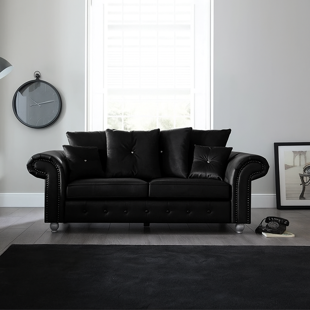 Elegant Leather Ashwin 3-Seater Sofa in Black— Modern Chesterfield design with button detailing and plush cushions in a bright living room