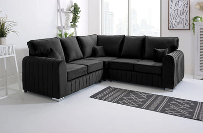 Black Lily High Back sofa in a modern living room with a rug and decor elements.