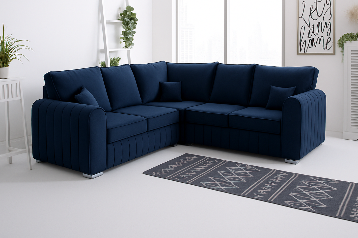 Navy blue High Back  sofa in a room with a rug and plants.