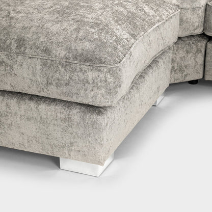 Close-up of a textured gray sofa corner on a white background