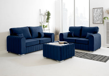 Navy blue sofa set in a modern living room with a coffee table.