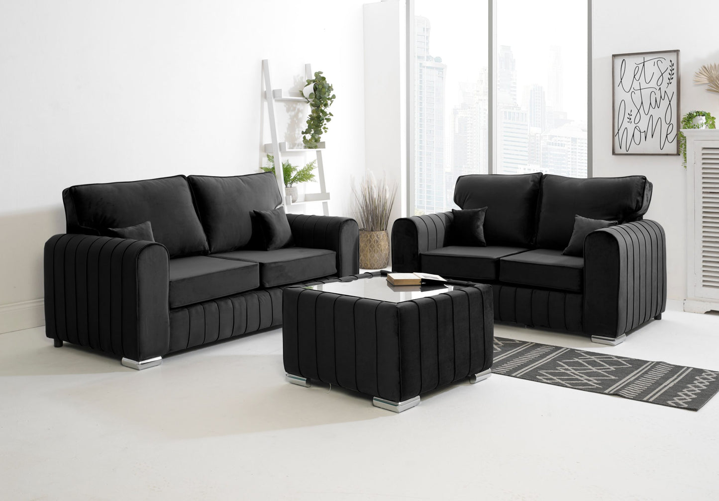 Black sectional sofa set in a modern living room with a coffee table.