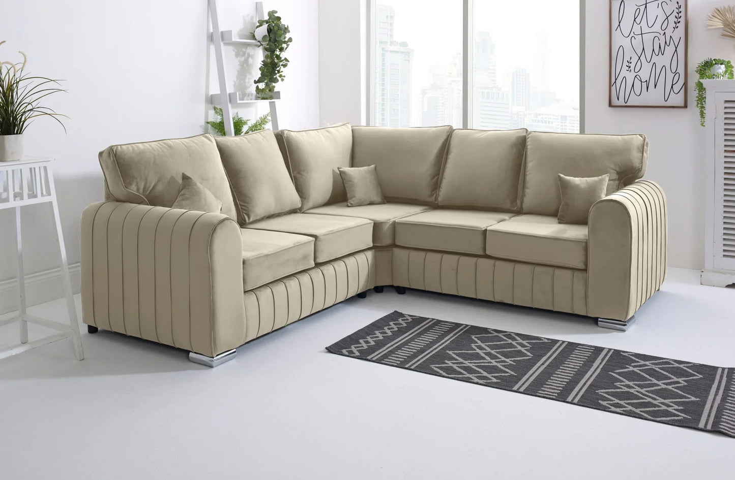 Beige sectional sofa in a modern living room with a rug and decor.