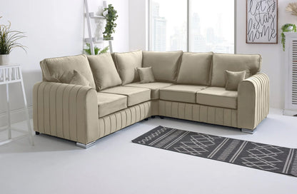 Beige sectional sofa in a modern living room with a rug and decor.