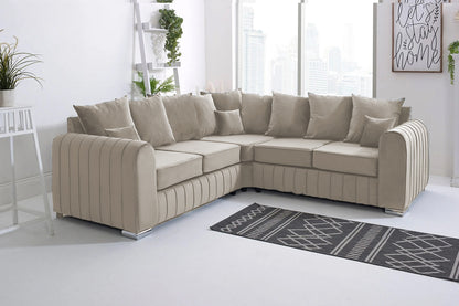 Beige sectional sofa in a modern living room with a rug and decorative elements.