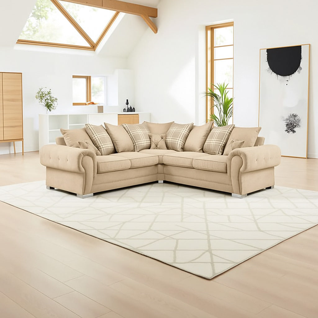 Beige sectional sofa in a modern living room with light wood flooring and white walls.