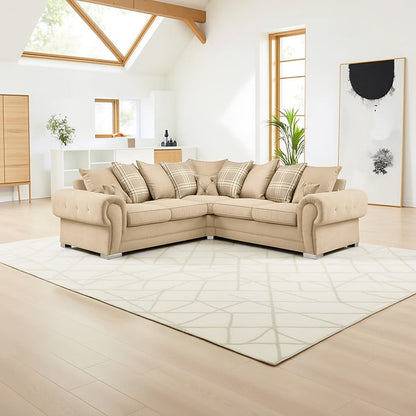 Beige sectional sofa in a modern living room with light wood flooring and white walls.